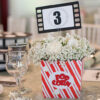 tema cinema, nunta tematica, nunta cinema, nunti tematice, nunti cinema, eveniment tematic cinema, vixy.ro, vixy design, numar masa cinema, botez cinema, tema nunta cinema, cutie popcorn cinema, eveniment personalizat cinema, cutie dar camera cinema, role cinema, role decor tema cinema, role film cinema, camera film cinema, camera film cutie, cutie personalizata cinema, cutie de dar cinema, meniu cinema, botezuri tematice, nunti tematice, oscar, cinematograf tematic